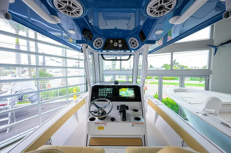 Slide: The Image of Interior view of 2025 Sportsman Masters 267 Bay Boat with modern dashboard and controls. - 10