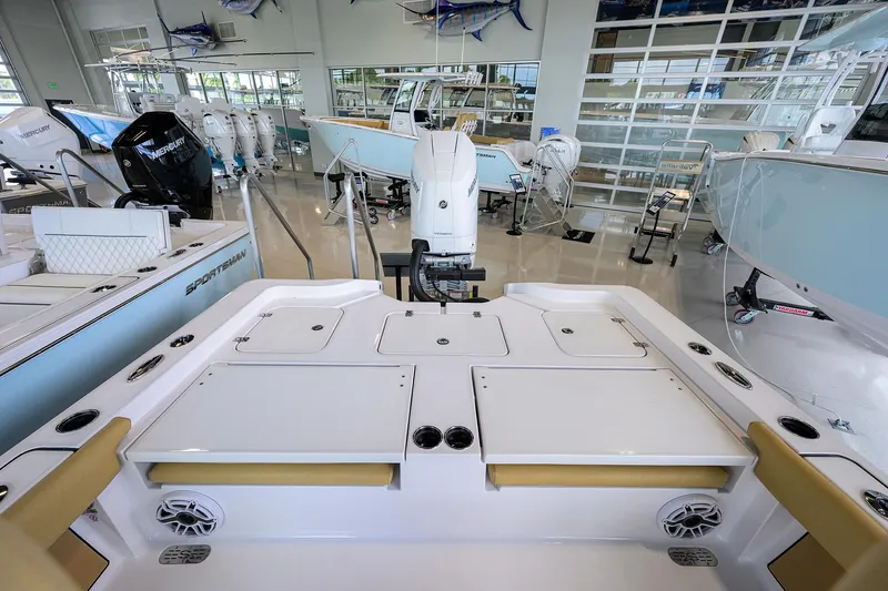 Slide: The Image of 2025 Sportsman Masters 267 Bay Boat interior in showroom, featuring sleek design and modern amenities. - 14