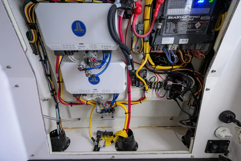 Slide: The Image of Electrical wiring and components inside a 2025 Sportsman Masters 267 Bay Boat. - 22
