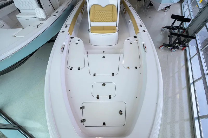 Slide: The Image of 2025 Sportsman Masters 267 Bay Boat interior with seating and storage compartments. - 29