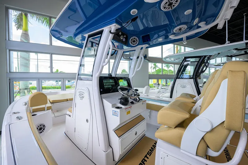 Slide: The Image of 2025 Sportsman Masters 267 Bay Boat interior with modern helm and seating. - 9