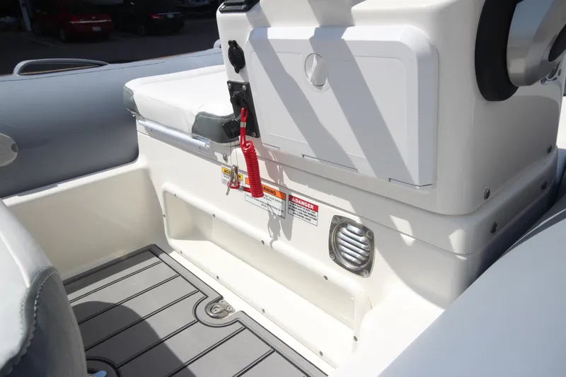 Slide: The Image of 2025 Zodiac Yachtline 360 DL PVC boat interior with seating and control panel. - 8