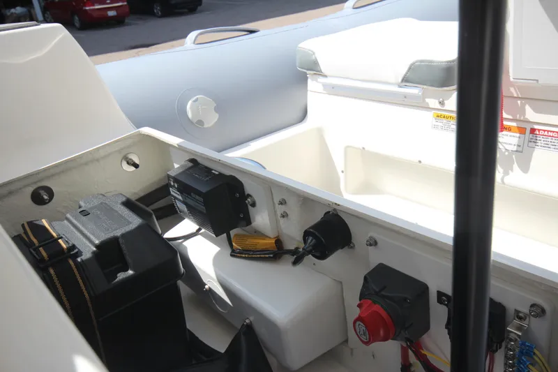 Slide: The Image of 2025 Zodiac Yachtline 360 DL PVC interior with equipment and storage compartments. - 7