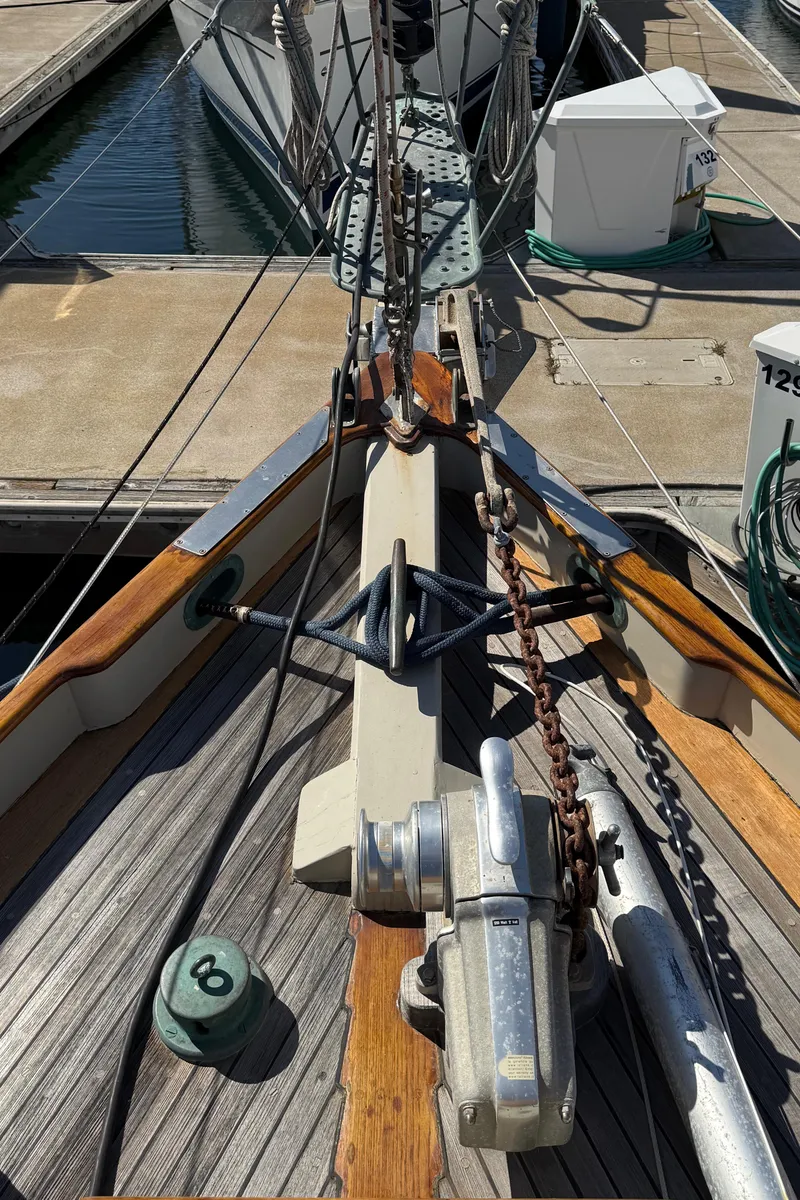 Slide: The Image of Historic 1932 Fellows & Stewart Yawl deck with anchor and mooring lines at marina. - 13