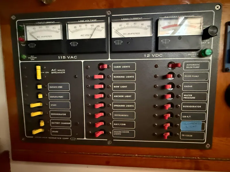 Slide: The Image of Electrical control panel on a 1932 Historic Fellows & Stewart Yawl, featuring various switches and gauges. - 18