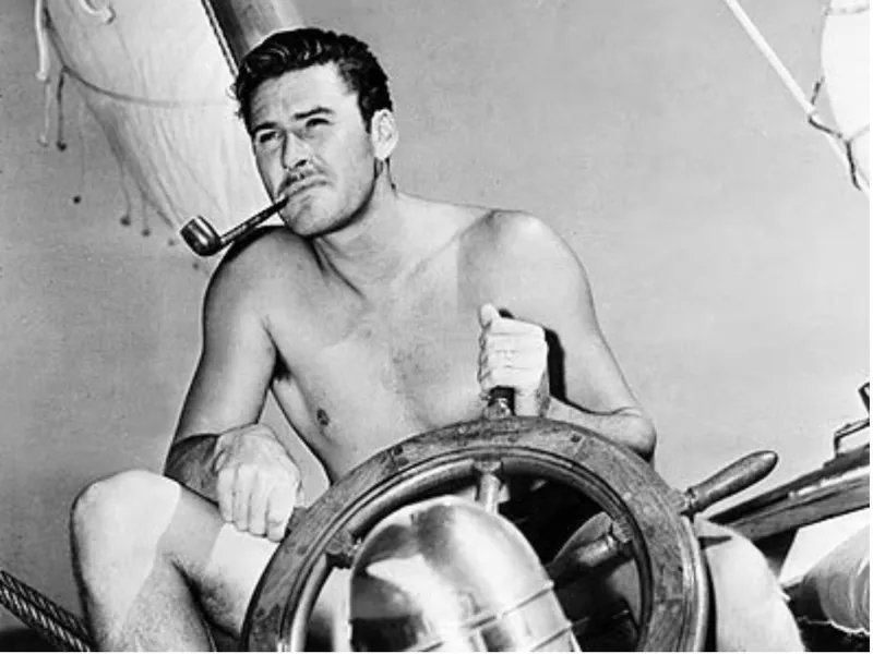 Slide: The Image of Shirtless man steering 1932 Fellows & Stewart Yawl, smoking pipe, vintage sailing scene. - 3