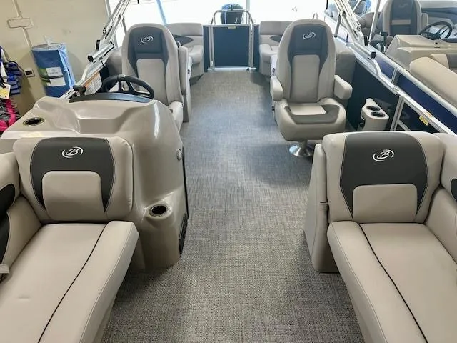 Slide: The Image of 2025 Barletta A22QC pontoon boat interior with plush seating and modern design. - 4