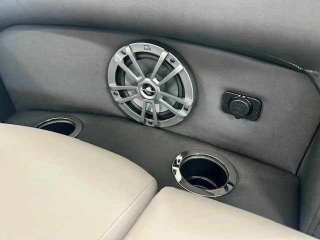 Slide: The Image of 2025 Barletta A22QC interior with speaker, cup holders, and control panel. - 9