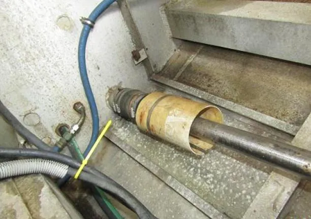 Slide: The Image of Close-up of a 1988 Custom Universal Ship Building Sport engine component with hoses and metal parts. - 11