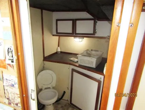 Slide: The Image of Small bathroom in 1988 Custom Universal Ship Building Sport vessel. - 5