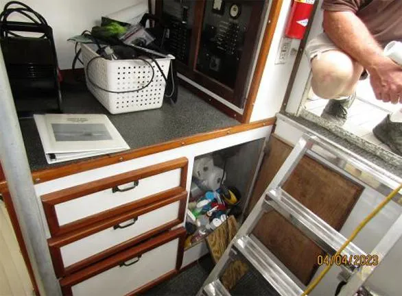 Slide: The Image of Interior of 1988 Custom Universal Ship Building Sport with storage, ladder, and equipment. - 7