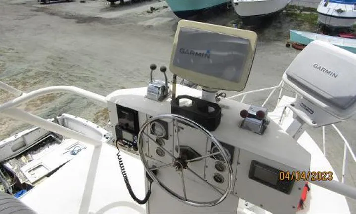 Slide: The Image of Helm of 1988 Custom Universal Ship Building Sport with Garmin navigation system. - 9