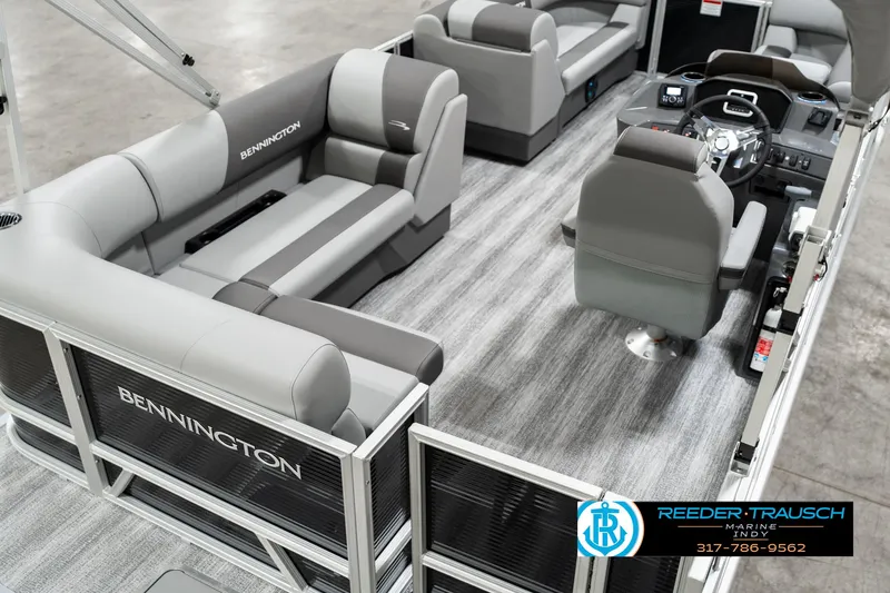 Slide: The Image of 2025 Bennington 118 SLS pontoon boat interior with gray seating and modern helm. - 11