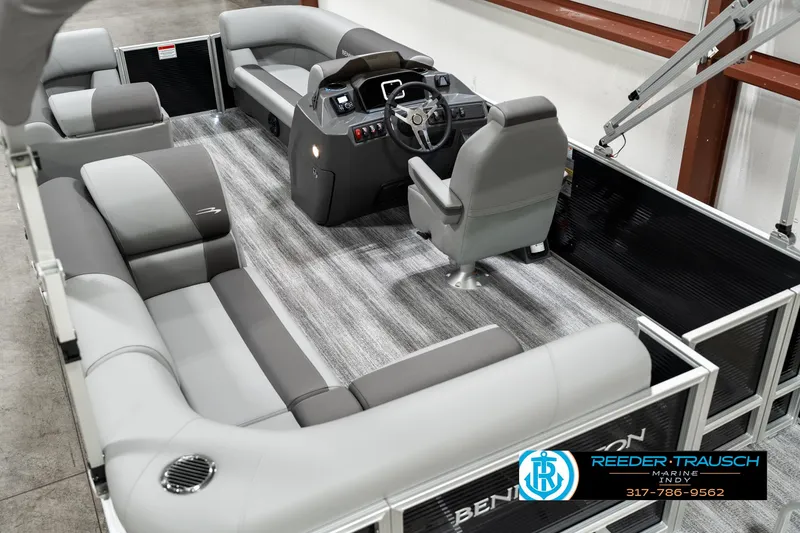 Slide: The Image of 2025 Bennington 118 SLS pontoon boat interior with gray seating and modern helm. - 12