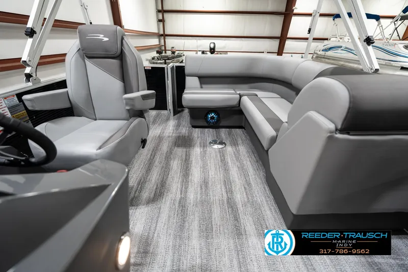 Slide: The Image of 2025 Bennington 118 SLS boat interior with gray seating and modern design. - 14