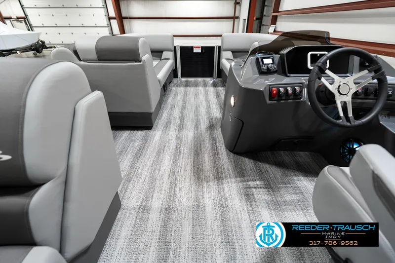 Slide: The Image of 2025 Bennington 118 SLS boat interior with modern seating and steering console. - 17