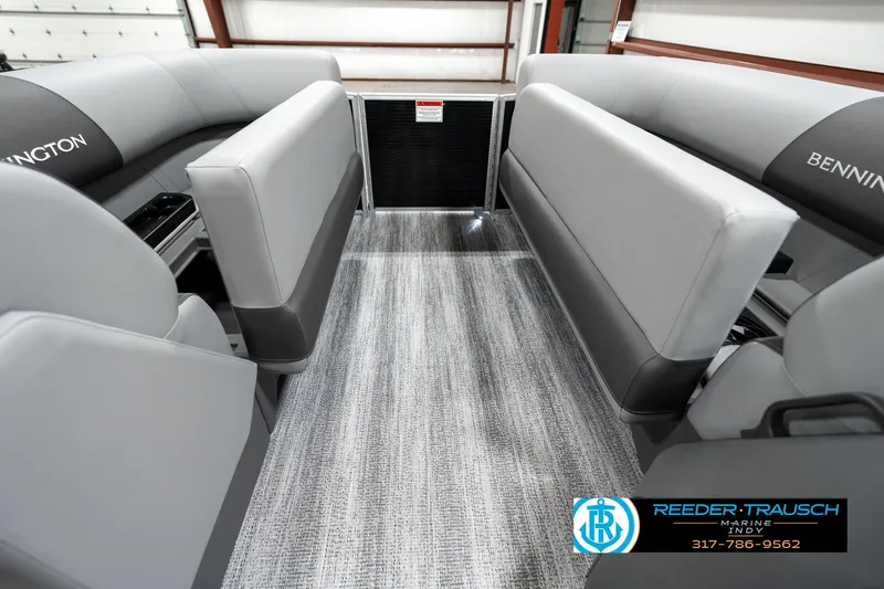 Slide: The Image of 2025 Bennington 118 SLS boat interior with gray seating and flooring. - 19