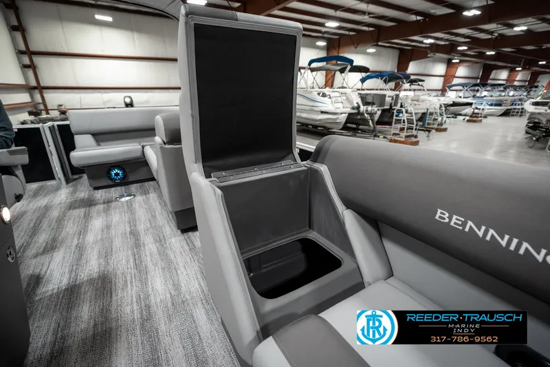 Slide: The Image of 2025 Bennington 118 SLS boat interior with open storage compartment in showroom. - 21