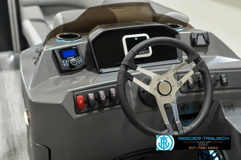 Slide: The Image of 2025 Bennington 118 SLS boat dashboard with steering wheel and control panel. - 28