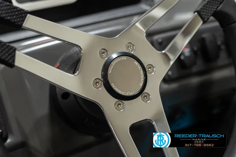 Slide: The Image of 2025 Bennington 118 SLS steering wheel detail with Reeder-Trausch Marine logo. - 29