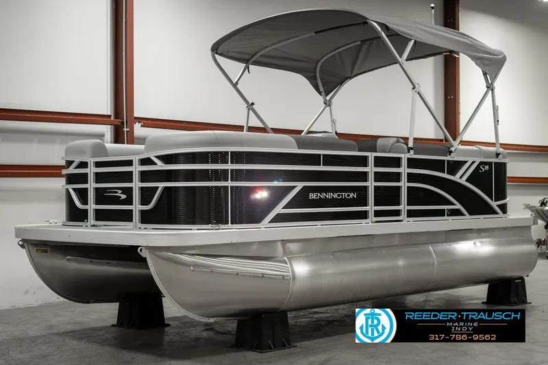 Slide: The Image of 2025 Bennington 118 SLS pontoon boat with canopy in showroom. - 3