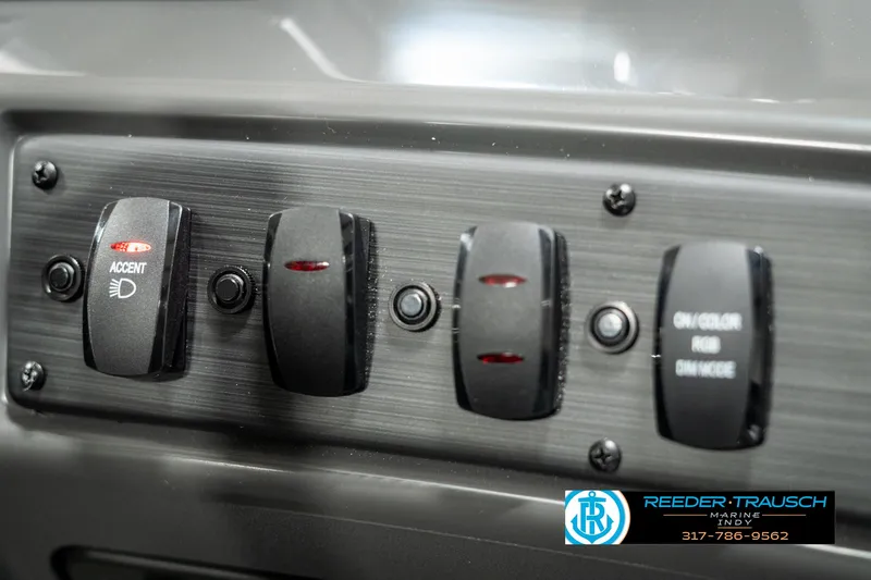 Slide: The Image of Control panel of 2025 Bennington 118 SLS boat with labeled switches. - 34