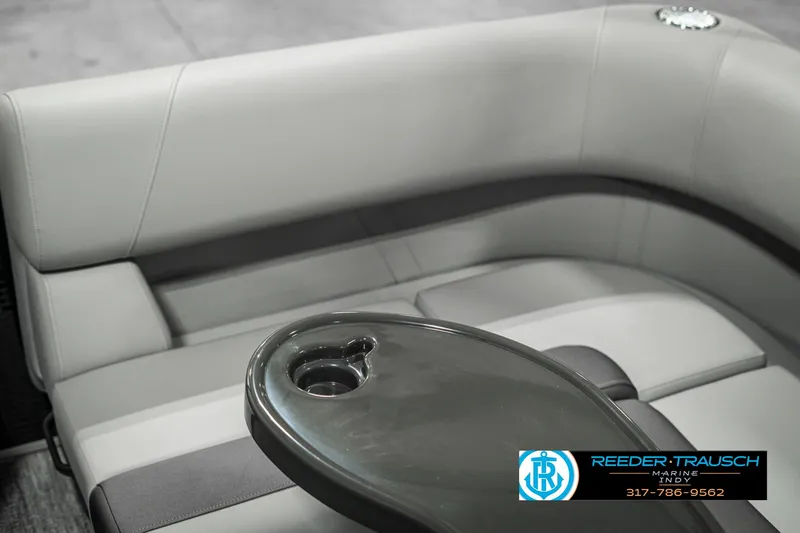 Slide: The Image of 2025 Bennington 118 SLS boat interior with sleek seating and cup holder. - 37