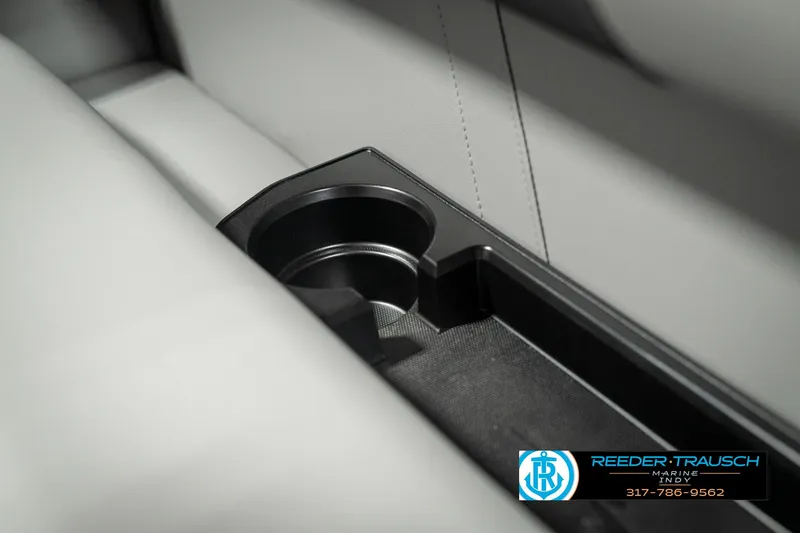 Slide: The Image of 2025 Bennington 118 SLS interior cup holder detail with sleek design. - 39