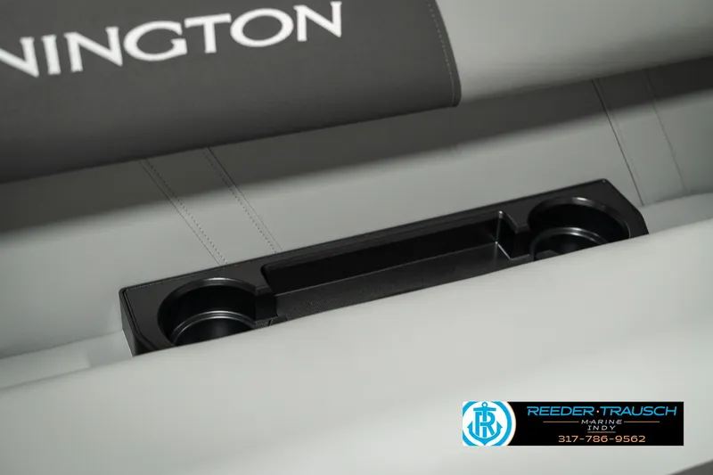 Slide: The Image of 2025 Bennington 118 SLS boat interior with cup holders and logo detail. - 40