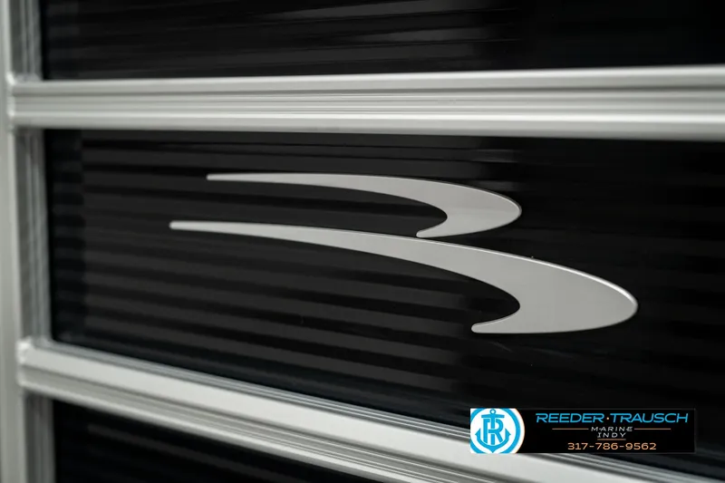 Slide: The Image of 2025 Bennington 118 SLS logo on sleek black surface. - 47