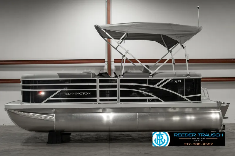Slide: The Image of 2025 Bennington 118 SLS pontoon boat with canopy in showroom. - 5