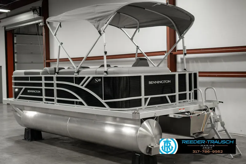 Slide: The Image of 2025 Bennington 118 SLS pontoon boat with canopy in showroom. - 6