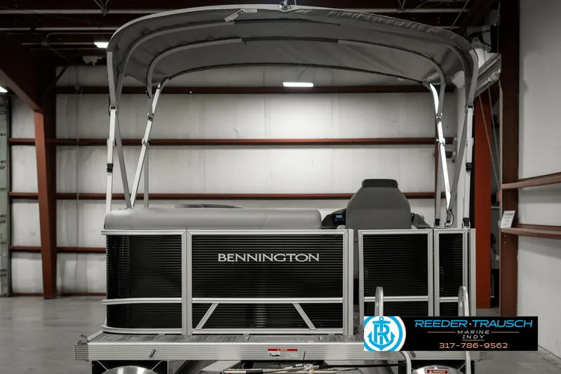 Slide: The Image of 2025 Bennington 118 SLS pontoon boat in warehouse, rear view. - 7