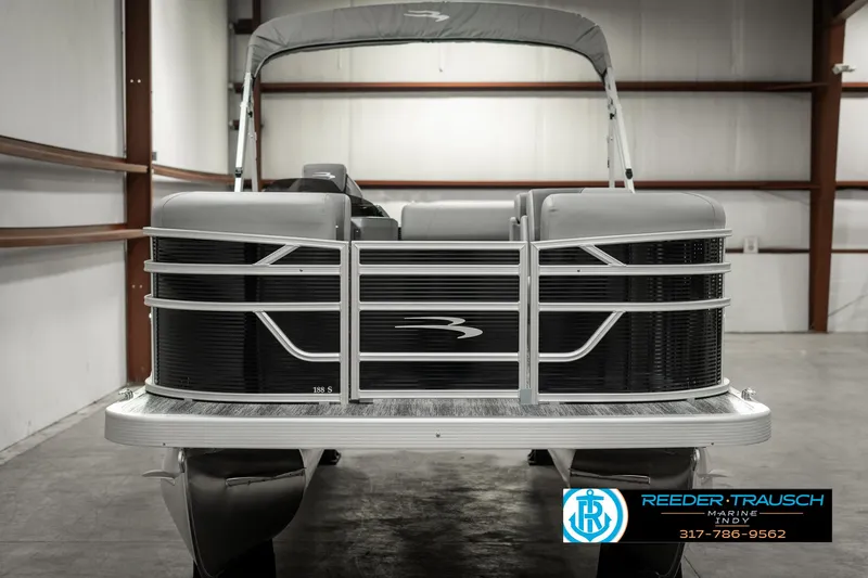 Slide: The Image of 2025 Bennington 118 SLS pontoon boat in showroom, front view. - 8