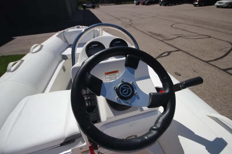 Slide: The Image of 2025 Zodiac Yachtline 400 DL NEO 50hp steering wheel and dashboard view. - 11