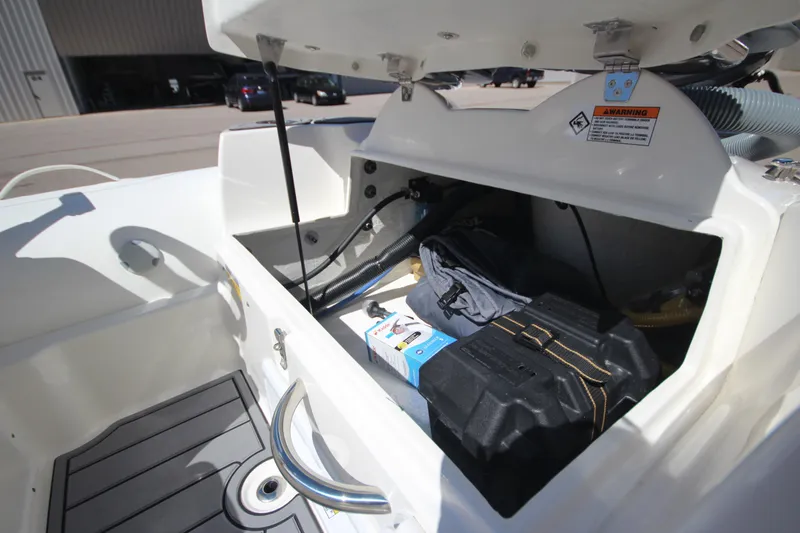 Slide: The Image of 2025 Zodiac Yachtline 400 DL NEO 50hp storage compartment with equipment and battery. - 7