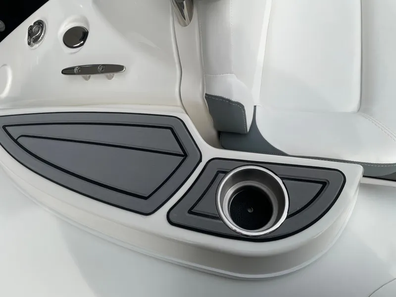 Slide: The Image of 2025 Zodiac Yachtline 490 Deluxe NEO interior detail with cup holder and sleek design. - 17