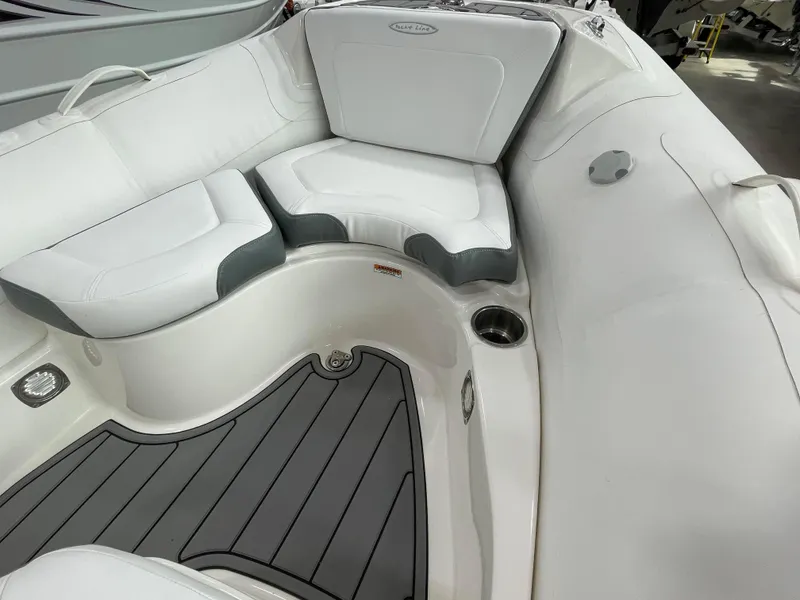 Slide: The Image of 2025 Zodiac Yachtline 490 Deluxe NEO interior with white seating and gray flooring. - 34