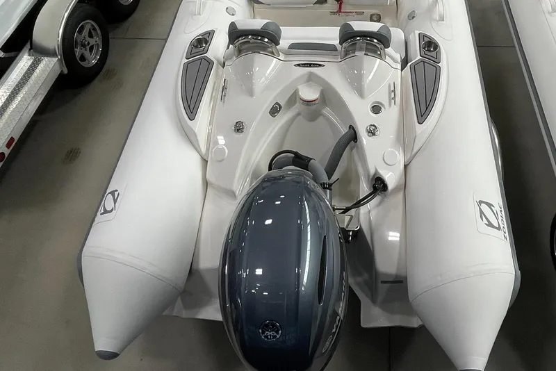 Slide: The Image of 2025 Zodiac Yachtline 490 Deluxe NEO 90hp inflatable boat, white, in stock, rear view. - 37