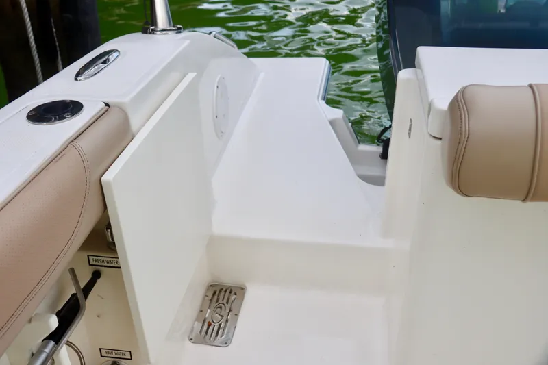 Slide: The Image of 2017 Pursuit DC 295 Dual Console boat interior with seating and step detail. - 13