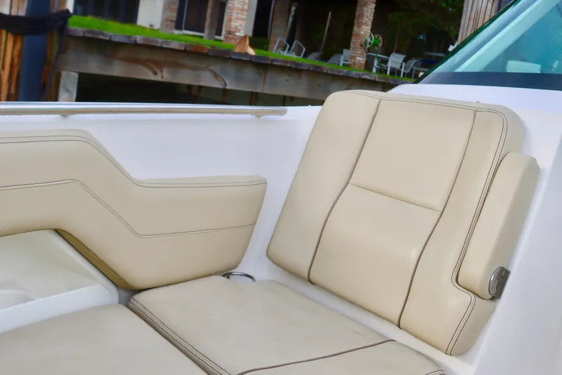 Slide: The Image of 2017 Pursuit DC 295 Dual Console boat with beige seating. - 24
