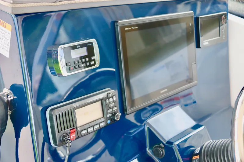 Slide: The Image of Control panel of 2017 Pursuit DC 295 Dual Console boat with navigation equipment. - 3