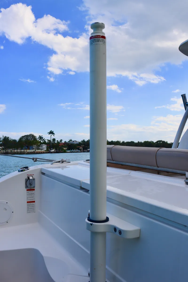 Slide: The Image of 2017 Pursuit DC 295 Dual Console boat interior with clear sky and water view. - 31