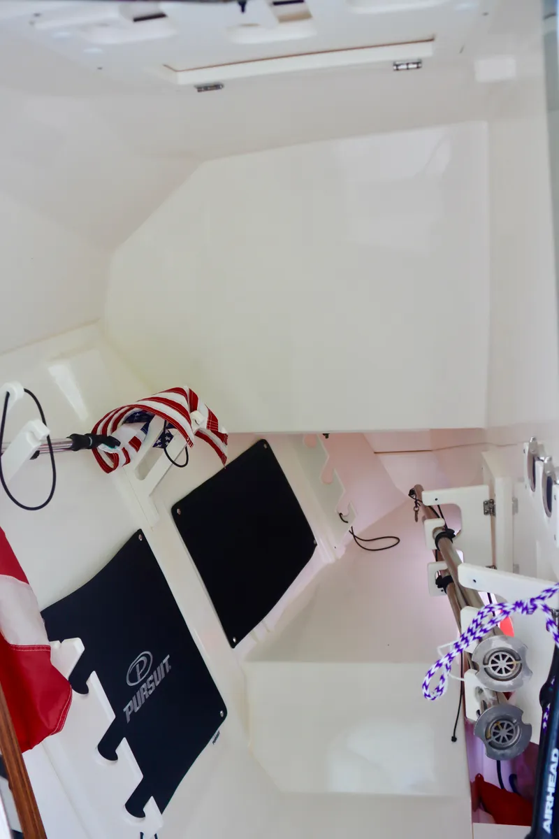 Slide: The Image of 2017 Pursuit DC 295 Dual Console interior with nautical accessories. - 6