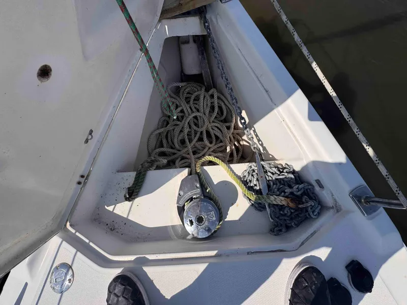 Slide: The Image of Anchor locker of 2008 Hunter 45 Center Cockpit sailboat with ropes and chains. - 13