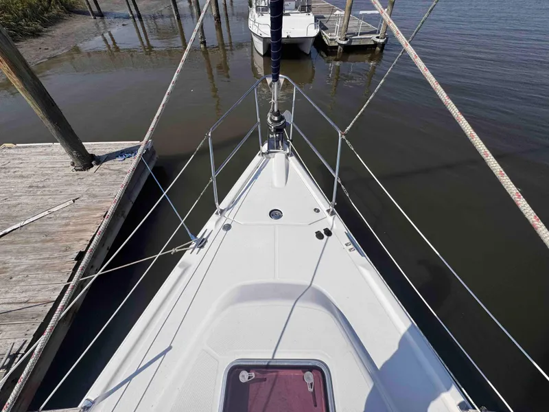 Slide: The Image of 2008 Hunter 45 Center Cockpit sailboat docked, view from bow. - 15