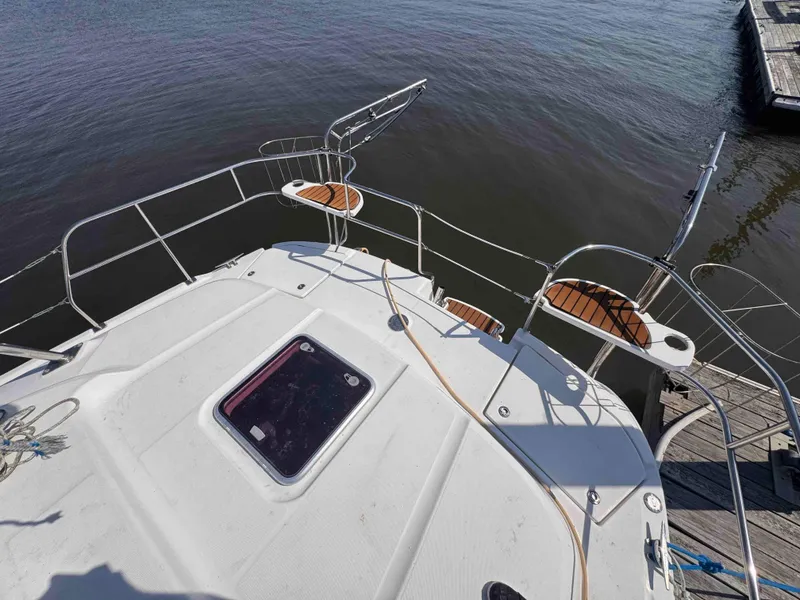 Slide: The Image of Hunter 45 Center Cockpit 2008 sailboat deck view at dock. - 18