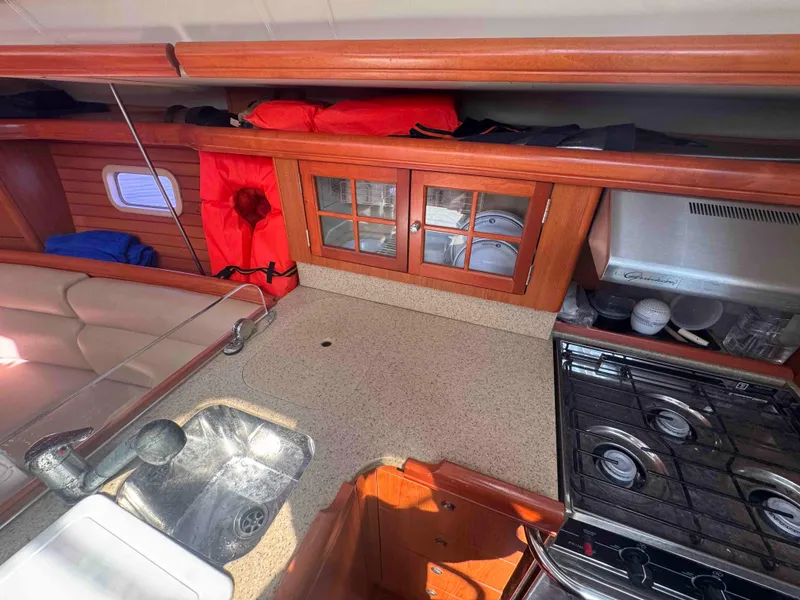 Slide: The Image of Interior of 2008 Hunter 45 Center Cockpit yacht with kitchen, sink, and stove. - 20