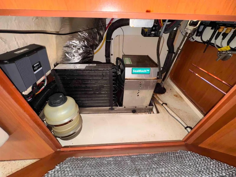 Slide: The Image of Engine compartment of 2008 Hunter 45 Center Cockpit sailboat with SeaMach unit. - 31