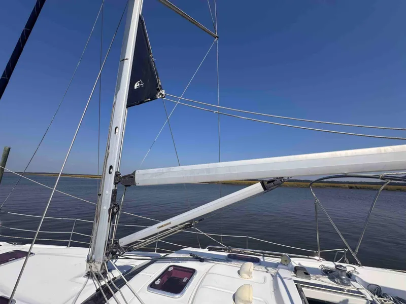 Slide: The Image of Sailboat deck view, 2008 Hunter 45 Center Cockpit, mast and rigging against clear blue sky. - 8